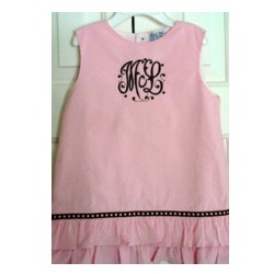 Pink pinafore dress with black machine embroidery monogram from the Splendor Alphabet